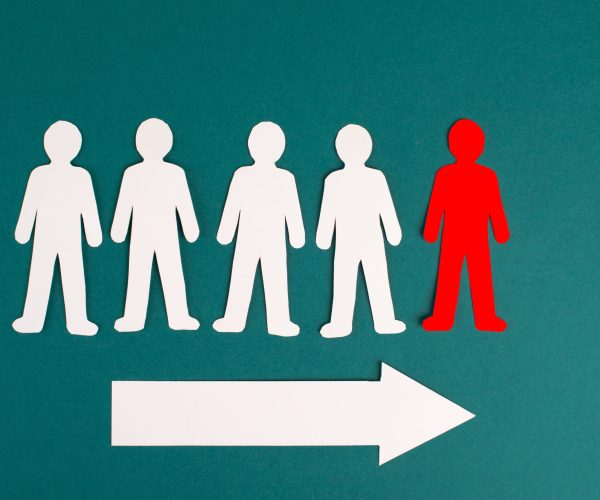 An illustration of a group of people following a leader