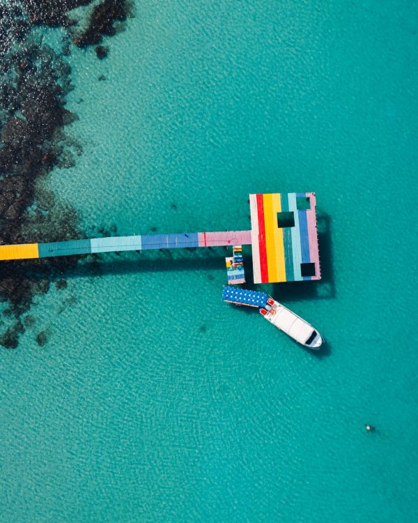 Wooden bridge at the beach and clear blue water,Go to the beach